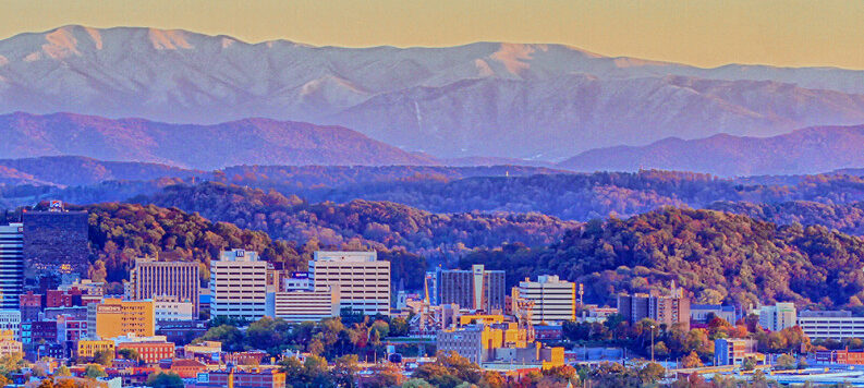 Scenic cityscape with towering mountains in the backdrop in Knoxville, Tennessee
